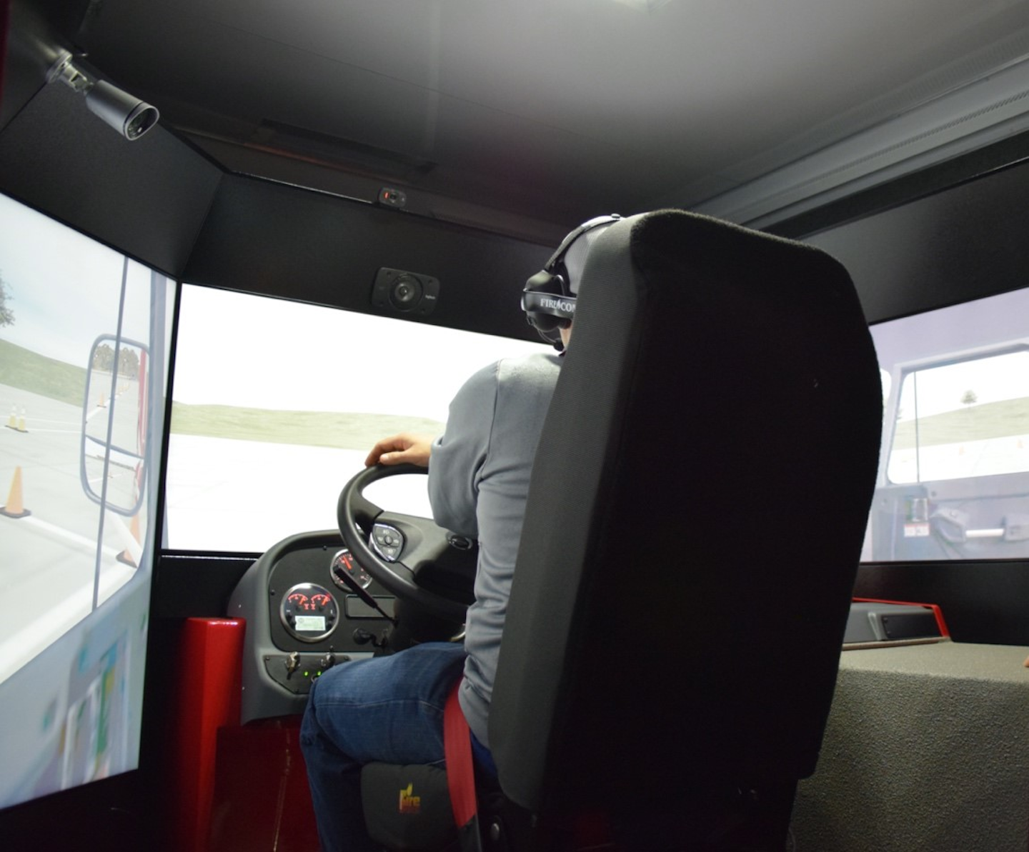 A student “drives” one of Illinois Fire Service Institute’s Driver Readiness Interactive Vehicle Experience (DRIVE) simulator stations, which is equipped with motion actuators.