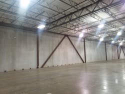 The warehouse’s floor slab (shown here) wasn’t adequate for heavy apparatus. It was replaced with an 8-inch-thick, heavily reinforced concrete slab. Continuous rigid insulation was applied to the interior surface of the warehouse’s concrete walls to permit climate-control of the office area and vehicle storage area. The warehouse’s floor slab (shown here) wasn’t adequate for heavy apparatus. It was replaced with an 8-inch-thick, heavily reinforced concrete slab. Continuous rigid insulation was applied to the interior surface of the warehouse’s concrete walls to permit climate-control of the office area and vehicle storage area.