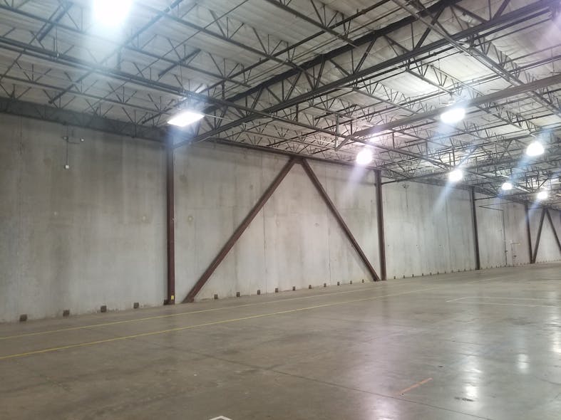 The warehouse&rsquo;s floor slab (shown here) wasn&rsquo;t adequate for heavy apparatus. It was replaced with an 8-inch-thick, heavily reinforced concrete slab. Continuous rigid insulation was applied to the interior surface of the warehouse&rsquo;s concrete walls to permit climate-control of the office area and vehicle storage area.