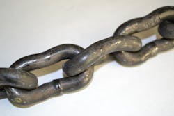 This rescue chain shows the effects of significant overloading. Note the collapsed sides of the links because of stretching and bending of the links. During SCAM program Step 3 (the inspection process), this chain would be identified as damaged, would be red-tagged and would be placed out-of-service immediately. This rescue chain shows the effects of significant overloading. Note the collapsed sides of the links because of stretching and bending of the links. During SCAM program Step 3 (the inspection process), this chain would be identified as damaged, would be red-tagged and would be placed out-of-service immediately.