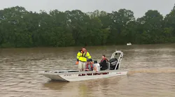 Alma, AR, firefighters help residents after heavy rainfall created severe flooding Thursday, leading to a state of emergency in Crawford County.