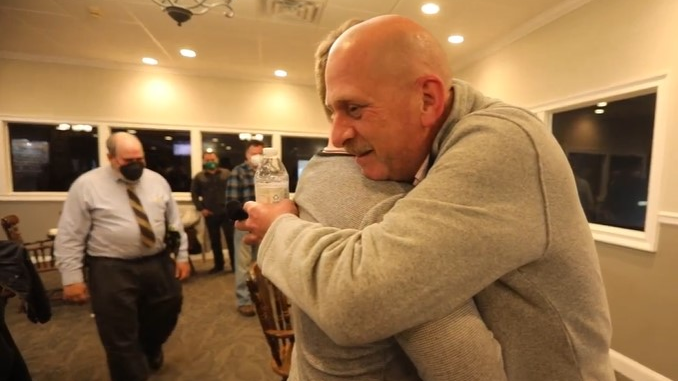 Retired Arlington, NY, firefighter William Porter embraces Jacob Tsukroff, who Porter had saved from a fatal fire in 1998, during a reunion in Poughkeepsie on Sunday.