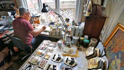 Bob Stella of Weymouth, MA, found a niche business in painting the colorful leather shields firefighters put on their helmets. Bob Stella of Weymouth, MA, found a niche business in painting the colorful leather shields firefighters put on their helmets.