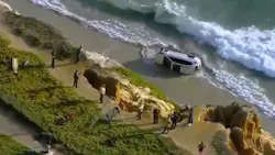 Carlsbad, CA, firefighters helped rescue a driver whose car plunged off a cliff and into the ocean Tuesday. Carlsbad, CA, firefighters helped rescue a driver whose car plunged off a cliff and into the ocean Tuesday.