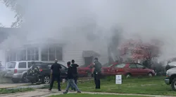 Champaign, IL, firefighters rescued four people from a burning house Thursday.