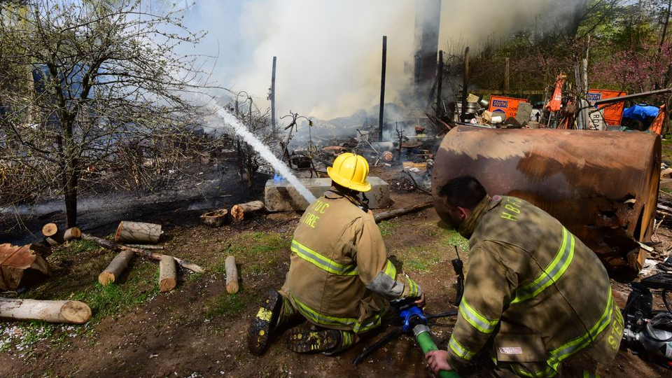 Firefighters from 13 departments battled a house fire that destroyed a Clinton Township, NJ, home early Tuesday.