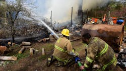 Firefighters from 13 departments battled a house fire that destroyed a Clinton Township, NJ, home early Tuesday.