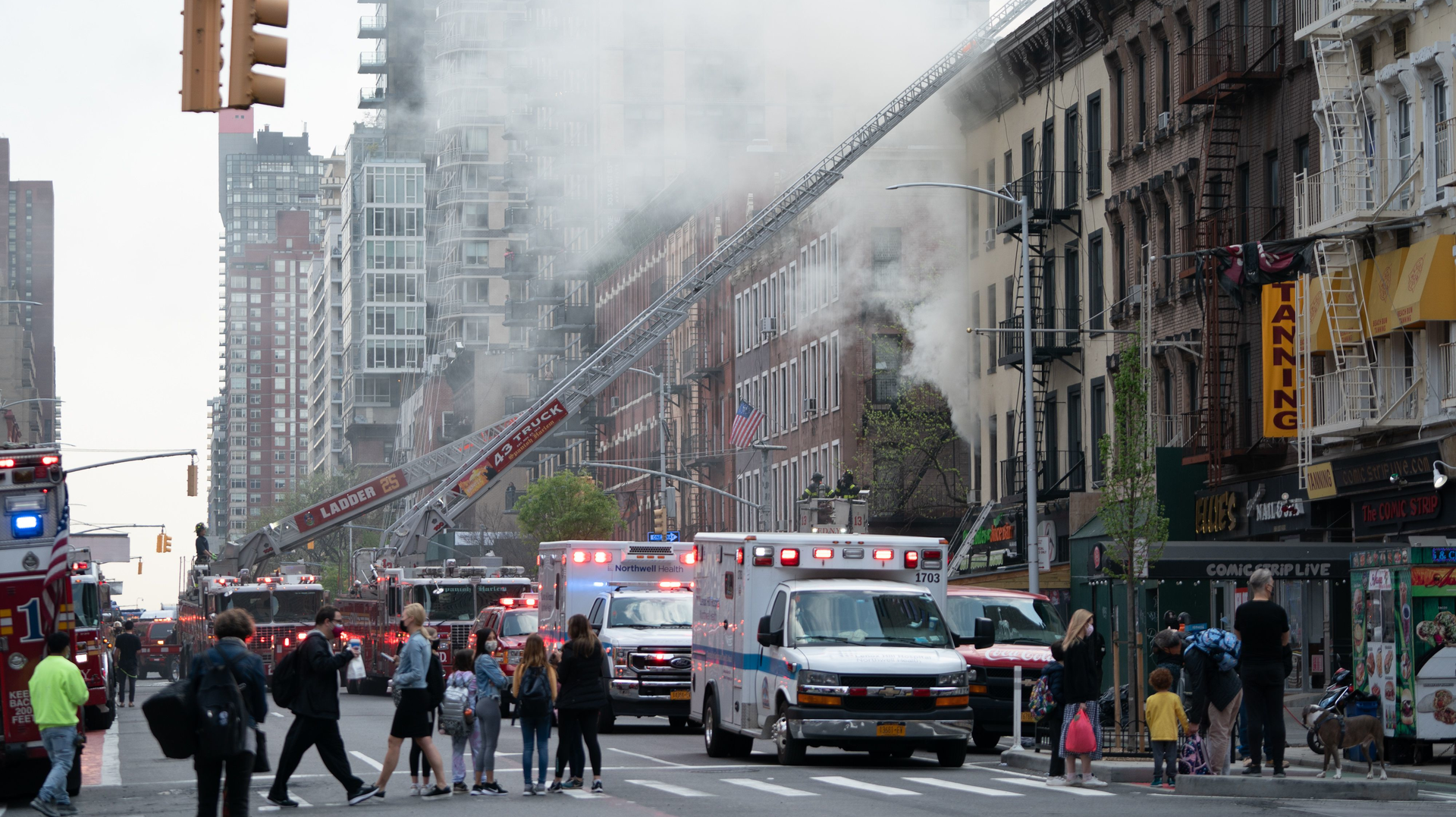 FDNY firefighters rescued a critically injured man from an Upper East Side apartment building fire that left another man dead Wednesday.