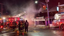 Two FDNY firefighters suffered serious injuries when they were trapped inside a burning Queens shop after a partial roof collapse early Saturday.