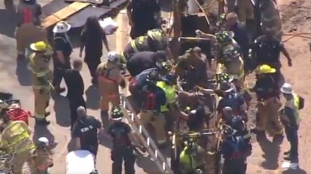 Firefighters rescued at least one construction worker after a partial trench collapse Wednesa=day