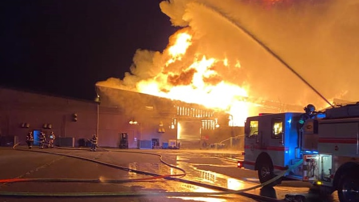 Firefighters from more than a dozen departments battled a three-alarm fire at a Shelton, WA, manufacturing building Tuesday.
