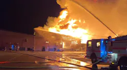 Firefighters from more than a dozen departments battled a three-alarm fire at a Shelton, WA, manufacturing building Tuesday.