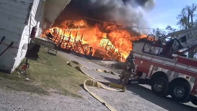 Video footage from a helmet camera shows Oklahoma City, OK, firefighters battling a three-alarm commercial fire Sunday.