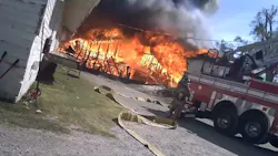 Video footage from a helmet camera shows Oklahoma City, OK, firefighters battling a three-alarm commercial fire Sunday.