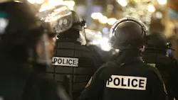 Around 100 protesters marched and set fire to the unoccupied Portland, OR, Police Association Building Tuesday.