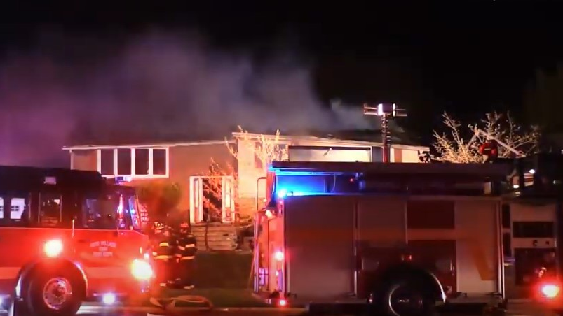 A Sauk Village, IL, firefighter was injured in a small explosion during a fatal house fire late Sunday.