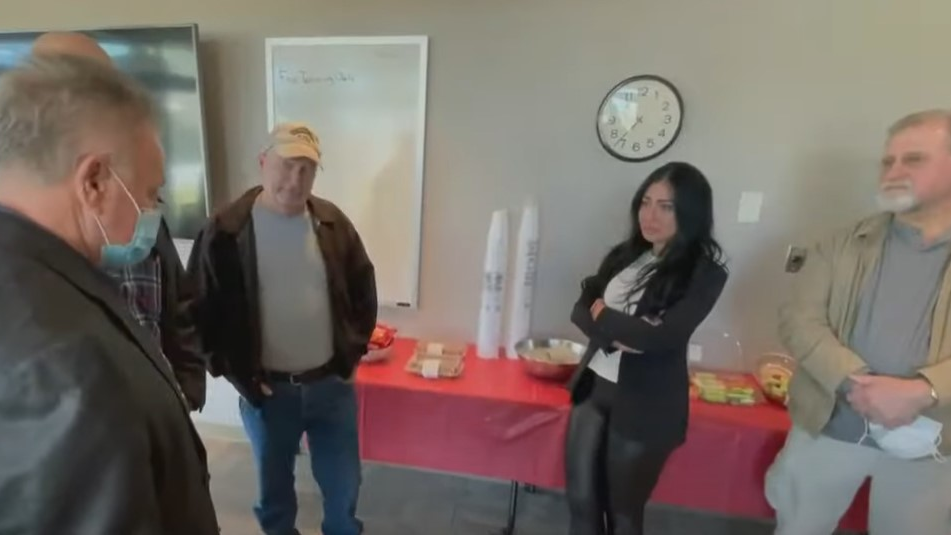 Jaqueline Luxenberg meets Saturday with the Smyrna, GA, firefighters who saved her from a fire caused by a Navy jet that crashed into an apartment complext in November 1989.