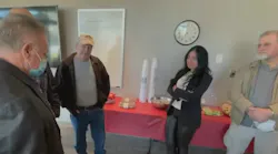 Jaqueline Luxenberg meets Saturday with the Smyrna, GA, firefighters who saved her from a fire caused by a Navy jet that crashed into an apartment complext in November 1989.