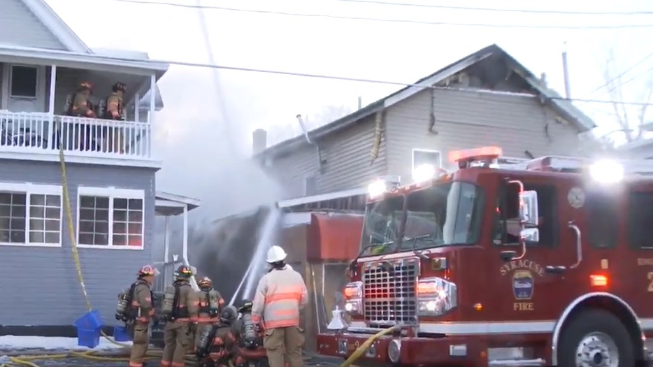 More than 50 Syracuse, NY, firefighters battled a fire that broke out in a building that houses a convenience store and apartments on the city's north side Thursday.