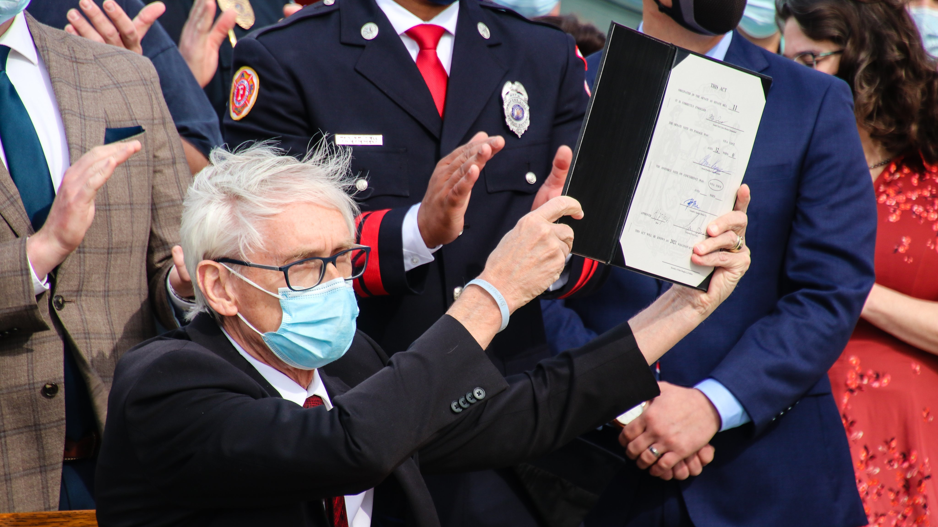 Wisconsin Gov. Tony Evers signed bipartisan legislation Thursday that provides workers' compensation benefits to firefighters and other first responders with PTSD.