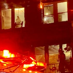 D.C. Fire and EMS crews battle a house fire on the district&apos;s northeast side that killed a man and his dog early Wednesday.