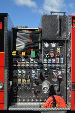 This pump panel was built by Four Guys Fire Apparatus for the Hagerstown, MD, Fire Department. Note how the crosslay discharge piping extends to the side of the panel and how the arrangement of the pump throttle and relief valve are below the master gauges and intake valve controls at the lower left corner.