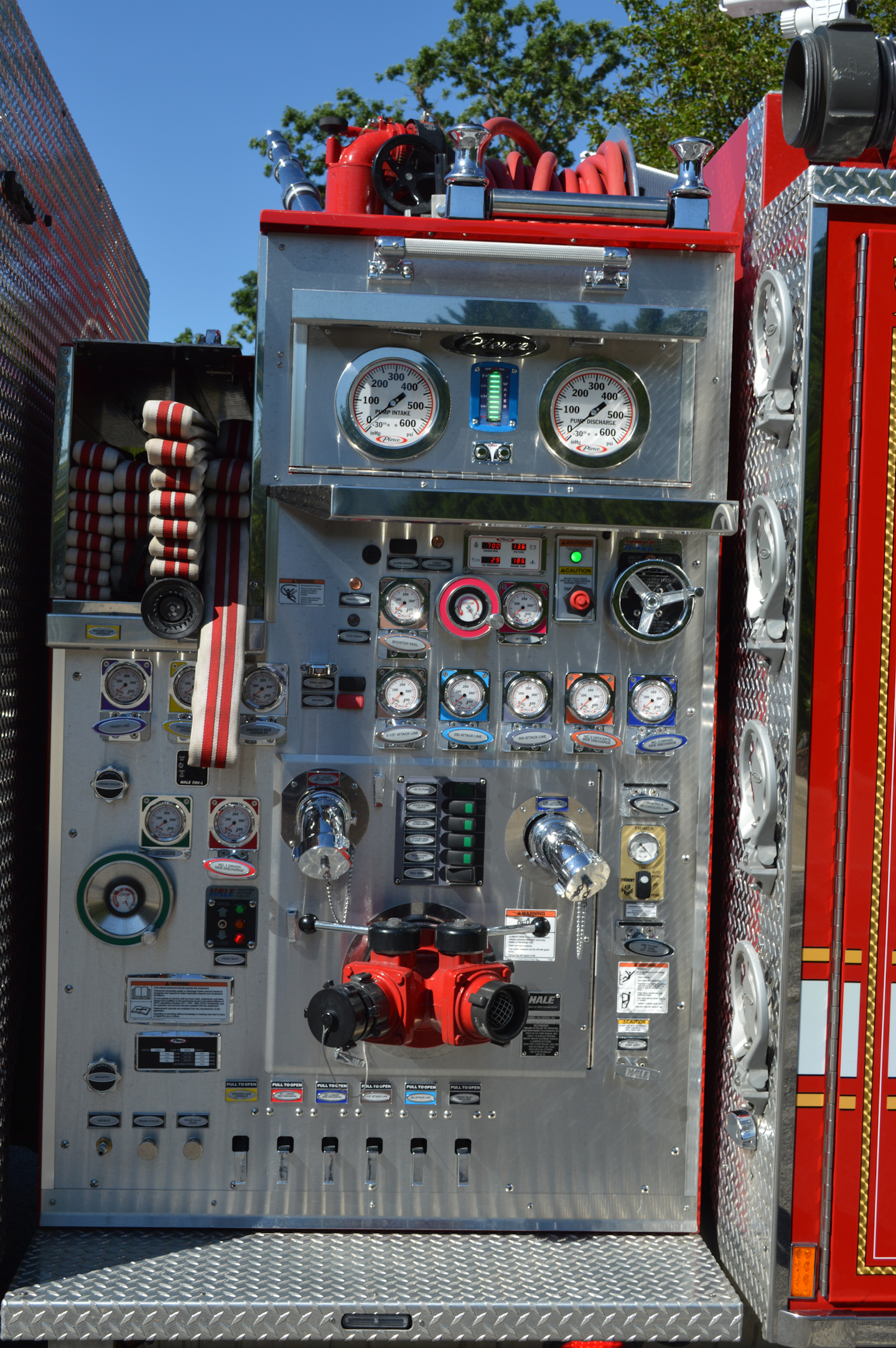 The Waldorf, MD, Volunteer Fire Department had Pierce Manufacturing construct this pump panel with a flush access panel around the steamer inlet and 2½-inch discharges. Note the location of the electronic throttle and relief valve below the 6-inch master gauges.