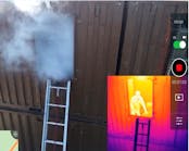 With qualitative thermography via a thermal imager on a drone, a victim can be seen clearly through smoke.