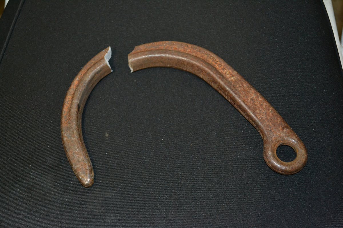 Premise 5. Unlike other destructive tests with new equipment, one test was conducted with an 8-inch J-hook that was at least three years old. It came from a rescue inventory and was used multiple times. The exterior of the J-hook was corroded. The WLL was listed as 5,400 lbs. The J-hook fractured at a peak load of 20,828 lbs., which is almost a 4:1 safety ratio, even after all of those years and use. The three-year old used and corroded J-hook (bottom) that had a WLL of 5,400 lbs. deformed open during its destructive test prior to a fracturing failure at a peak load of more than 20,000 lbs. Note how much larger/wider the opening is compared with the new J-hook. They were the same prior to the test.