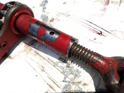 The inspection hole on this end of the ratchet-style load binder allows monitoring of the extension of the threaded rod. This hole still shows threaded rod inside and therefore indicates that there is sufficient thread contact at this end to achieve its’ WLL. Remember to remain at or below WLL to assure rescuer safety. The inspection hole on this end of the ratchet-style load binder allows monitoring of the extension of the threaded rod. This hole still shows threaded rod inside and therefore indicates that there is sufficient thread contact at this end to achieve its’ WLL. Remember to remain at or below WLL to assure rescuer safety.