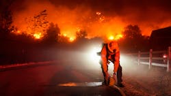 Firefighters battle the Bond Fire in Silverado, CA, in December.