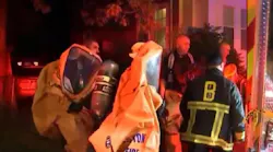 Two Boston firefighters and four residents were decontaminated after a Level 3 hazmat incident was declared when a man brought an unknown chemical to a fire station in the city's Roslindale neighborhood late Monday.