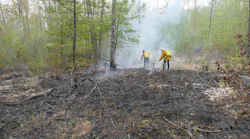 A firefighter was injured battling a wildfire that burned through 12 acres in Brownsfield, ME, on Monday.