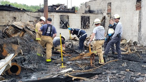 Investigators scour the scene Tuesday of a multi-alarm fire that broke out at a shopping plaza in Solomons, MD, late Monday, causing nearly $3 million in damage.
