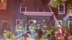 D.C. Fire and EMS firefighters pulled a critically injured woman from the first floor of a burning rowhouse early Wednesday.