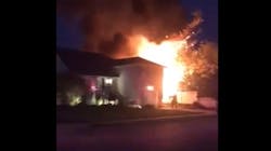 Flames from a Long Island, NY, house fire caused two propane tanks to explode Thursday. Flames from a Long Island, NY, house fire caused two propane tanks to explode Thursday.