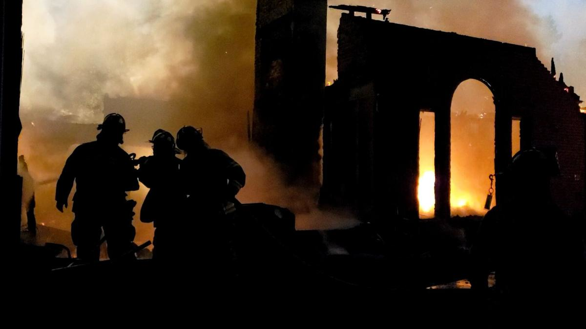 More than 30 firefighters from multiple departments battled a two-alarm fire at a house in Floyds Knob, IN, on Thursday.