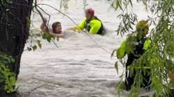 Fort Worth, TX, firefighters rescued a woman caught in fast-moving flooding after her minivan was swept away in the high waters Monday. Fort Worth, TX, firefighters rescued a woman caught in fast-moving flooding after her minivan was swept away in the high waters Monday.