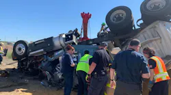 Franklin County, WA, firefighters worked for around two hours to extricate a truck driver from the wreckage of his tractor-trailer, which overturned near Mesa on Monday.