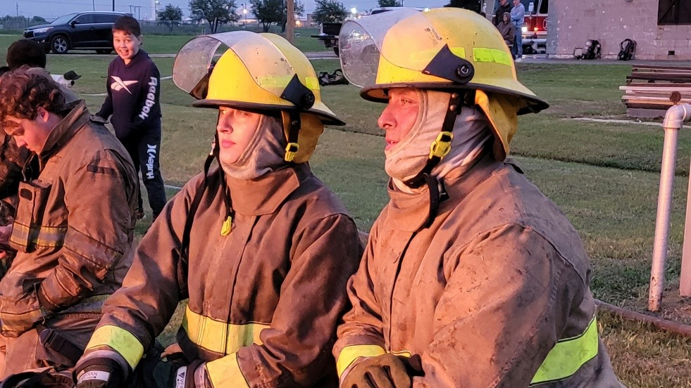 Alexis Thompson (left) and her dad, Billy Thompson, of Godley, TX, attended Hill College's fire academy and graduated from the program last week.