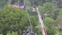 Arlington County, VA, Fire Department&apos;s Tower 104 was used to help untangle the iconic U.S. flag at the Marine Corps War Memorial on Sunday.