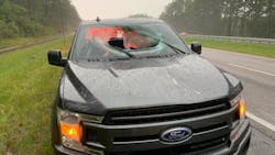 Two people were injured in Walton County, FL, on Monday when a lightning strike sent a chunk of highway through the windshield of a moving pickup truck. Two people were injured in Walton County, FL, on Monday when a lightning strike sent a chunk of highway through the windshield of a moving pickup truck.