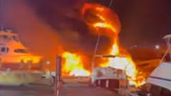 Miami firefighters put out a large fire that destroyed two abandoned yachts docked in a Miami River marina early Thursday. Miami firefighters put out a large fire that destroyed two abandoned yachts docked in a Miami River marina early Thursday.