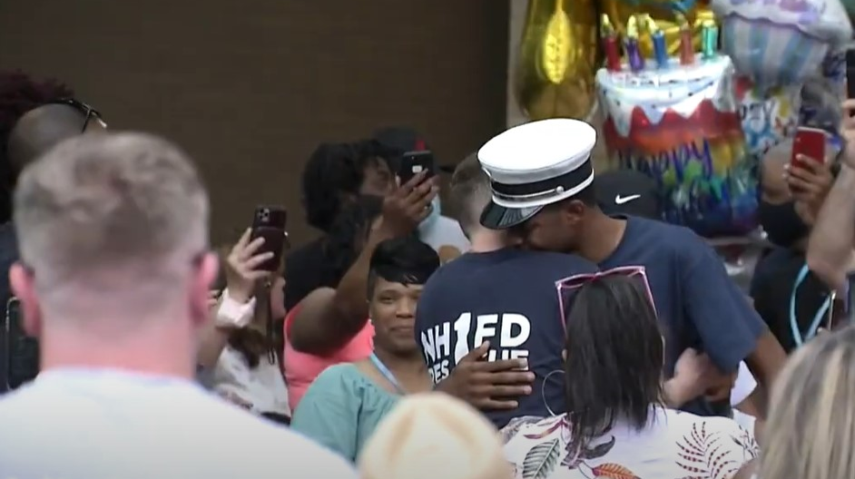 A supporter hugs New Haven, CT, Fire Lt. Samod 'Nuke' Rankins as he's released from the hospital Sunday.