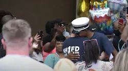 A supporter hugs New Haven, CT, Fire Lt. Samod 'Nuke' Rankins as he's released from the hospital Sunday.