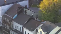 Paterson, NJ, firefighters battled a three-alarm fire that quickly spread through three apartment buildings early Friday.