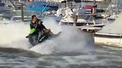 Off-duty Rochester, NY, firefighter Oscar Herrera used his jet ski to help put out a boat fire in Irondequoit Bay on May 20. Off-duty Rochester, NY, firefighter Oscar Herrera used his jet ski to help put out a boat fire in Irondequoit Bay on May 20.