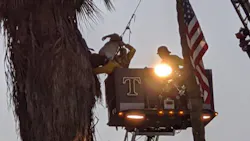 San Miguel, CA, firefighters rescued an injured tree trimmer trapped about 70 fee in the air Thursday.