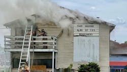 A Springfield, IL, firefighter was injured by a falling ceiling while battling a fire at a former sports and recreation complex Monday.
