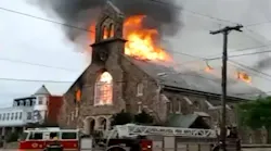Philadelphia firefighters battled a two-alarm fire that destroyed a vacant church in Tacony on Sunday.